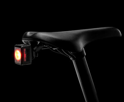 trek precaliber 24 8 speed suspension kids bike close up view of saddle, seatpost, and rear light