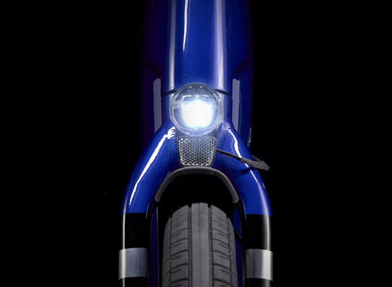 trek verve+ 3 aluminum 9 speed lowstep active e-bike close-up on front of bike and bike light
